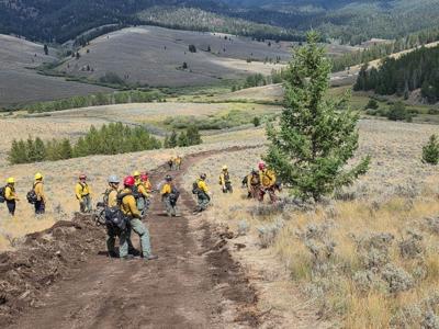 Firefighters line Sand Creek fire