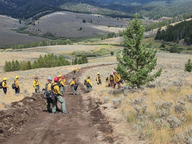 Firefighters line Sand Creek fire