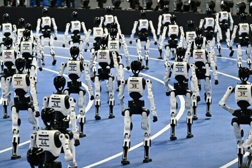 Humanoid robots take part in the opening ceremony of the 2nd World Humanoid Robot Games in Beijing on August 22, 2026