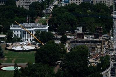 A view of the ongoing construction of a helipad (L) and ballroom (R) at the White House, as seen from the Washington Monument observation deck in Washington in July 2026