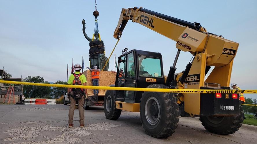 "Lady Montana" statue is removed from the top of the State Capitol building.