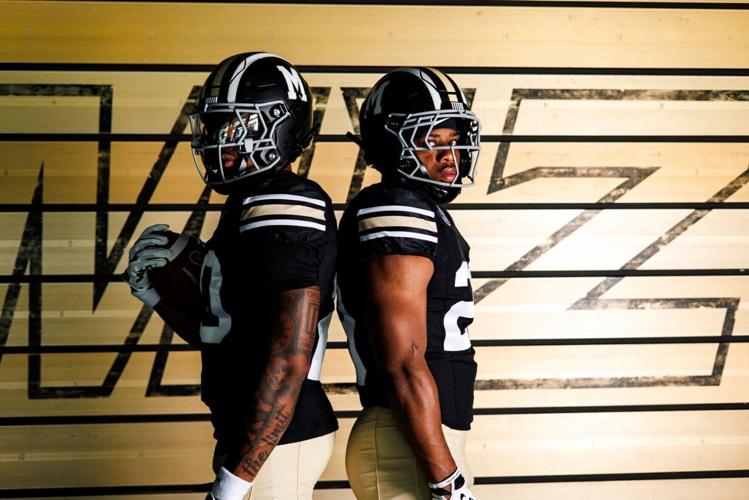 A pair of Mizzou football players model
