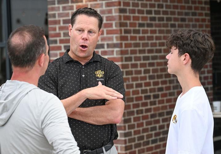 From left, Doug Quinn, Mizzou Athletic Director Laird Veatch and Alex Quinn